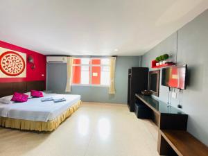 Postel nebo postele na pokoji v ubytování Phang Nga Guesthouse