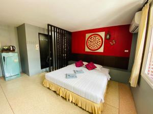 Postel nebo postele na pokoji v ubytování Phang Nga Guesthouse