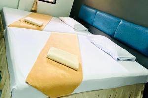 Postel nebo postele na pokoji v ubytování Phang Nga Guesthouse