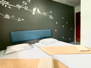Postel nebo postele na pokoji v ubytování Phang Nga Guesthouse