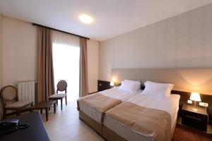 Postel nebo postele na pokoji v ubytování Hotel Majdan