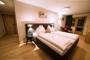 Voodi või voodid majutusasutuse Hotel Bradabella - Montafon toas