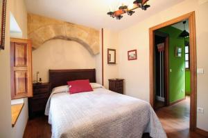Giường trong phòng chung tại Casa de Aldea Peña Sobia
