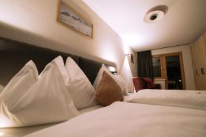Voodi või voodid majutusasutuse Hotel Bradabella - Montafon toas