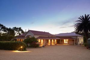 a large house with a driveway in front of it at Le Mas Barossa in Rowland Flat