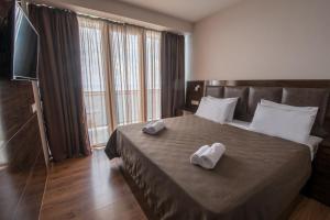 Postel nebo postele na pokoji v ubytování Orbi Beach Tower Hotel Official