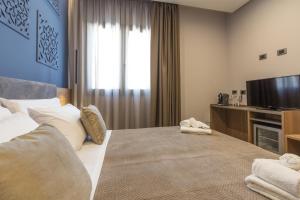Giafra Luxury Rooms客房内的一张或多张床位