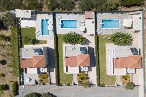 an aerial view of a house with a pool at Agios Antonios Villas in Agia Triada