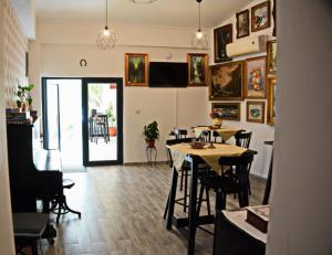 a living room with a table and a dining room at Neferprod Apartments - IS - CAM 02 in Timişoara