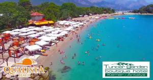 an overhead view of a beach with people in the water at Tuncer Garden Hotel in Kemer