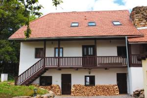 a large white house with a balcony on it at Vila Anička Vimperk in Vimperk