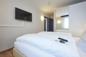 Tempat tidur dalam kamar di Hotel Anhalt