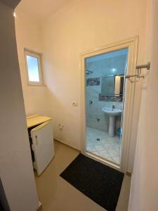 a bathroom with a shower and a sink at Guest House Lionel in Durrës