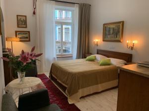 a hotel room with a bed and a window at NB Apartments Riga Old Town in Riga