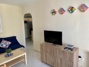 TV/Unterhaltungsangebot in der Unterkunft Neptuno Beachfront Apartments