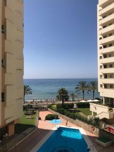 a view of the ocean from the balcony of a hotel at Neptuno Beachfront Apartments in Marbella