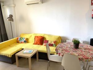 Ein Sitzbereich in der Unterkunft Neptuno Beachfront Apartments