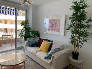Ein Sitzbereich in der Unterkunft Neptuno Beachfront Apartments
