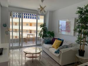 Ein Sitzbereich in der Unterkunft Neptuno Beachfront Apartments