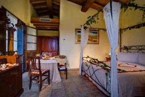 Posteľ alebo postele v izbe v ubytovaní Villa Hotel Valle Del Marta Resort