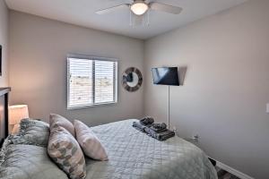 a bedroom with a bed and a ceiling fan at Luxe Home with OHV Access, 5 Mi to Lake Mohave! in Bullhead City