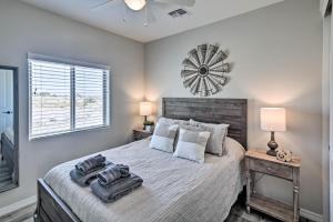 a bedroom with a large bed and a window at Luxe Home with OHV Access, 5 Mi to Lake Mohave! in Bullhead City +26 photos