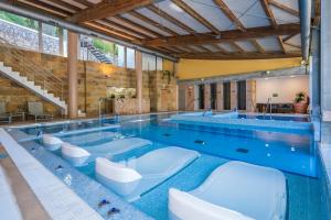 a large swimming pool with several toilets in it at ARTIEM Audax - Adults Only in Cala Galdana