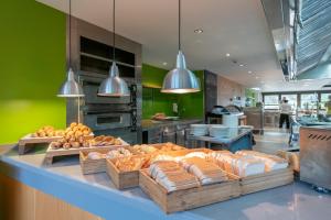 a bakery with a display of bread and other food at ARTIEM Audax - Adults Only in Cala Galdana