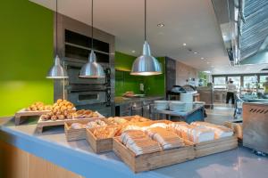 
a kitchen filled with lots of different types of pastries at ARTIEM Audax - Adults Only in Cala Galdana
