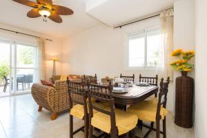 A seating area at Happy Holiday Home! 2 pools - Walk to Town & Beach
