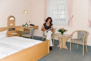 Postel nebo postele na pokoji v ubytování Hotel Ebner