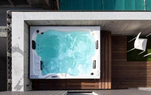a bath tub sitting on top of a wall at PortoSoul Trindade in Porto