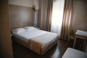 Кровать или кровати в номере Hotel Laitau