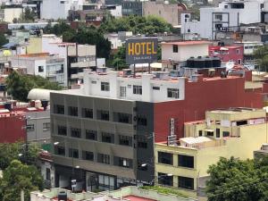 a building with a hotel sign on top of it at Hotel Casa Blanca Internacional in Mexico City
