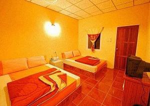 Postel nebo postele na pokoji v ubytování Ban Tonnam Resort