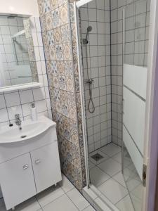 Koupelna v ubytování Napfény Apartman + 9 fotografií