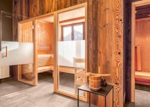 Postel nebo postele na pokoji v ubytování ALMMONTE SENSUM SUITES Boutique Hotel