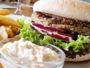 a close up of a sandwich and fries and dip at The Dog & Crook in Romsey