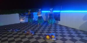 a group of women standing on a checkered floor at Cat Villa Kawajimamachi in Kawagoe
