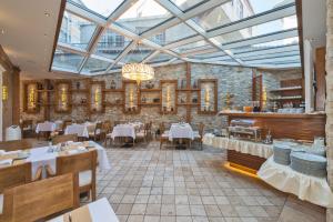 a restaurant with tables and chairs and a glass ceiling at The Million Stone Hotel - Special Category in Istanbul