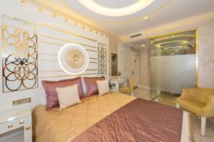 a bedroom with a large bed and a large mirror at The Million Stone Hotel - Special Category in Istanbul