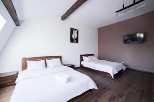 Postel nebo postele na pokoji v ubytování Aparthotel Na Mytniy