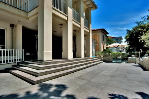 a building with steps and a porch at Le Rose Spa Hotel in Rimini