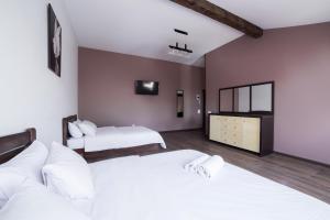 Postel nebo postele na pokoji v ubytování Aparthotel Na Mytniy