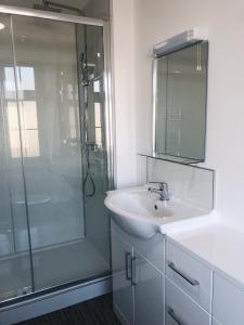 a bathroom with a shower and a sink and a mirror at Endsleigh Park Hotel in Hull +57 photos
