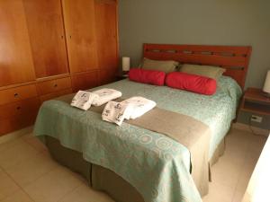 Una cama o camas en una habitación de Apart Agustina
