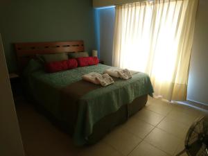 Una cama o camas en una habitación de Apart Agustina