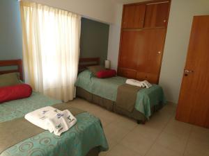 Una cama o camas en una habitación de Apart Agustina