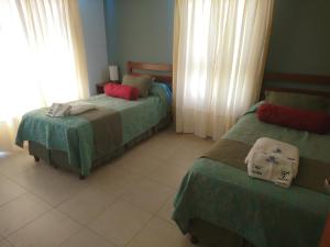 Una cama o camas en una habitación de Apart Agustina