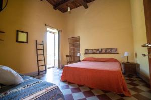 Postel nebo postele na pokoji v ubytování La Casa sul Blu Albergo Diffuso